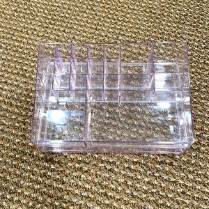 Makeup holder. Various compartments for storing makeup w/drawer underneath.